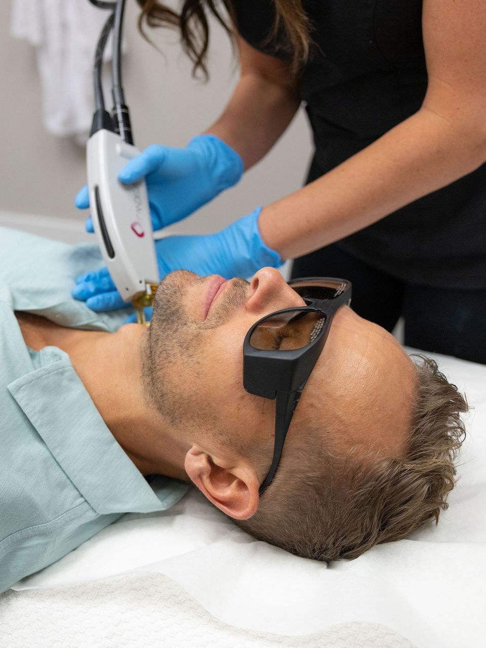 man getting laser hair removal