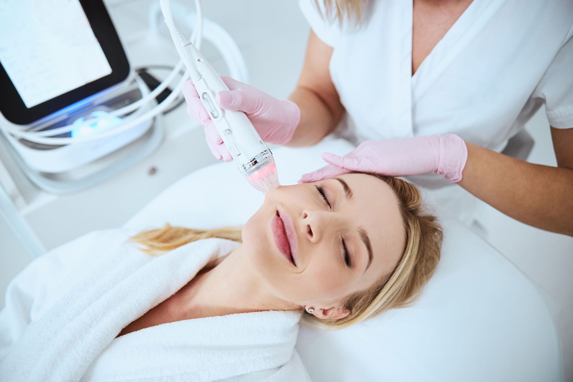 woman getting microneedling treatment