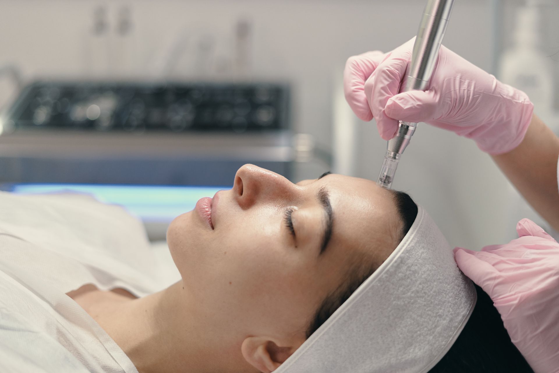 woman getting microneedling treatment