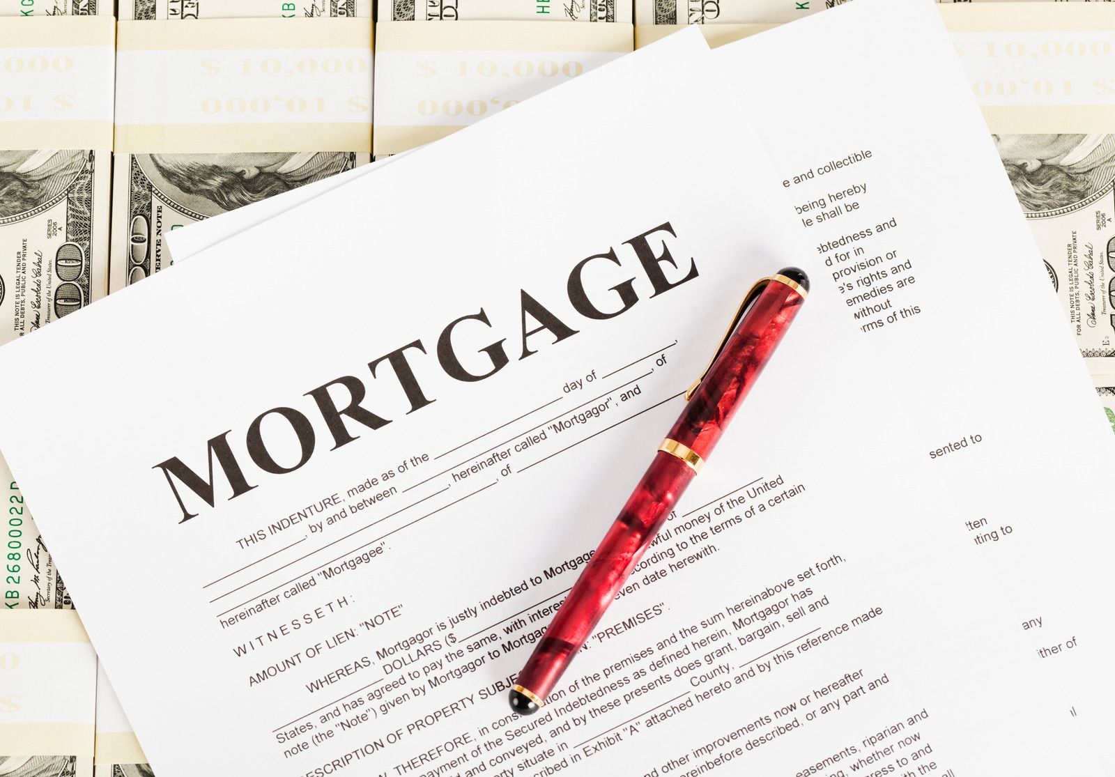 A man in a suit and tie stands next to a woman in a blue dress