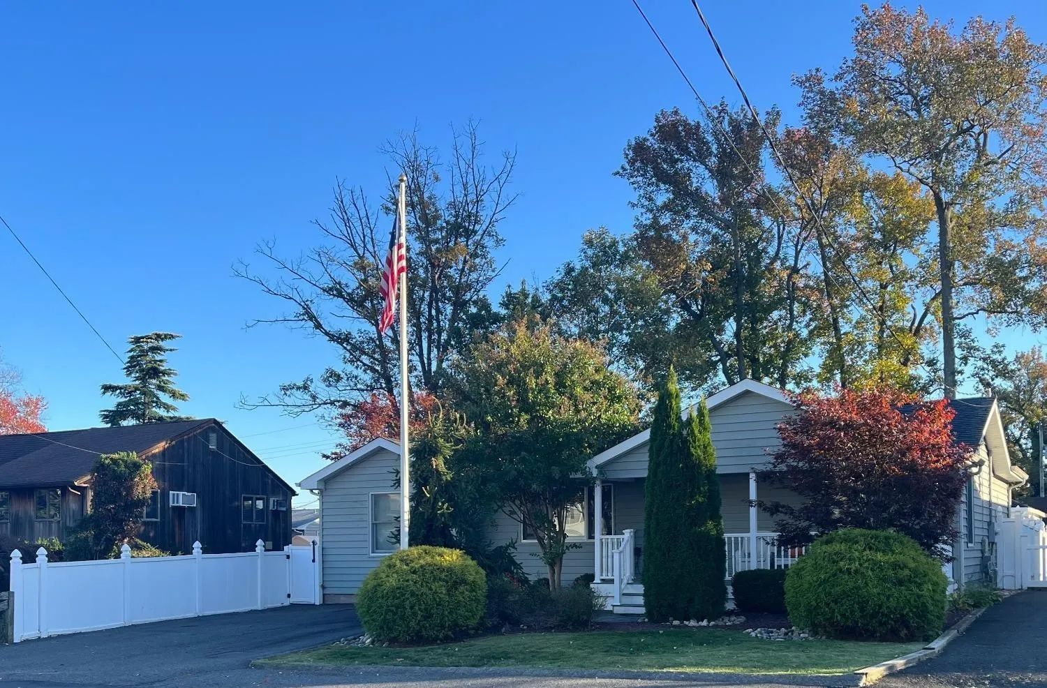A house with a flag on a pole in front of it