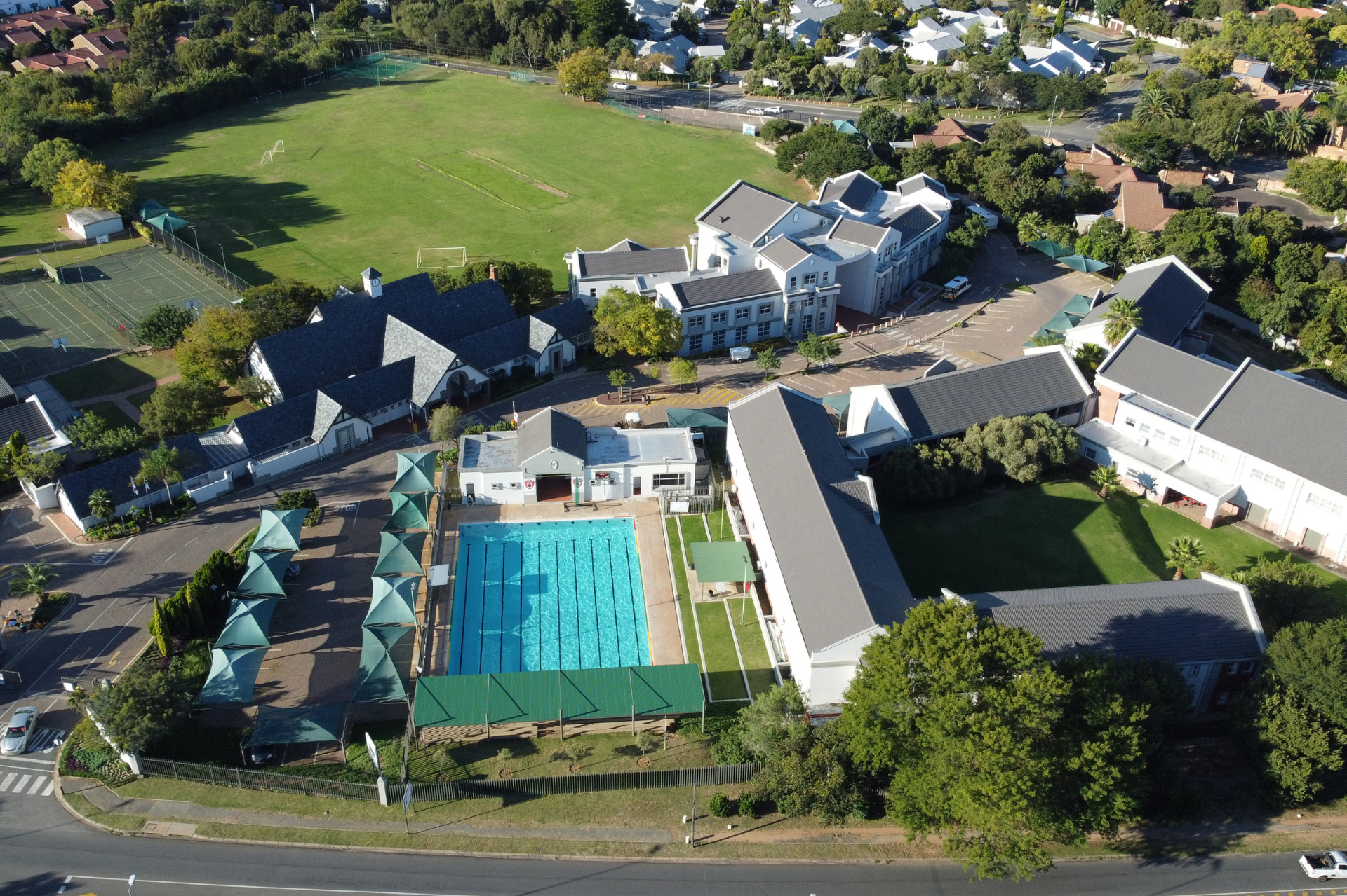 an aerial view of a hockey field with a river in the background .