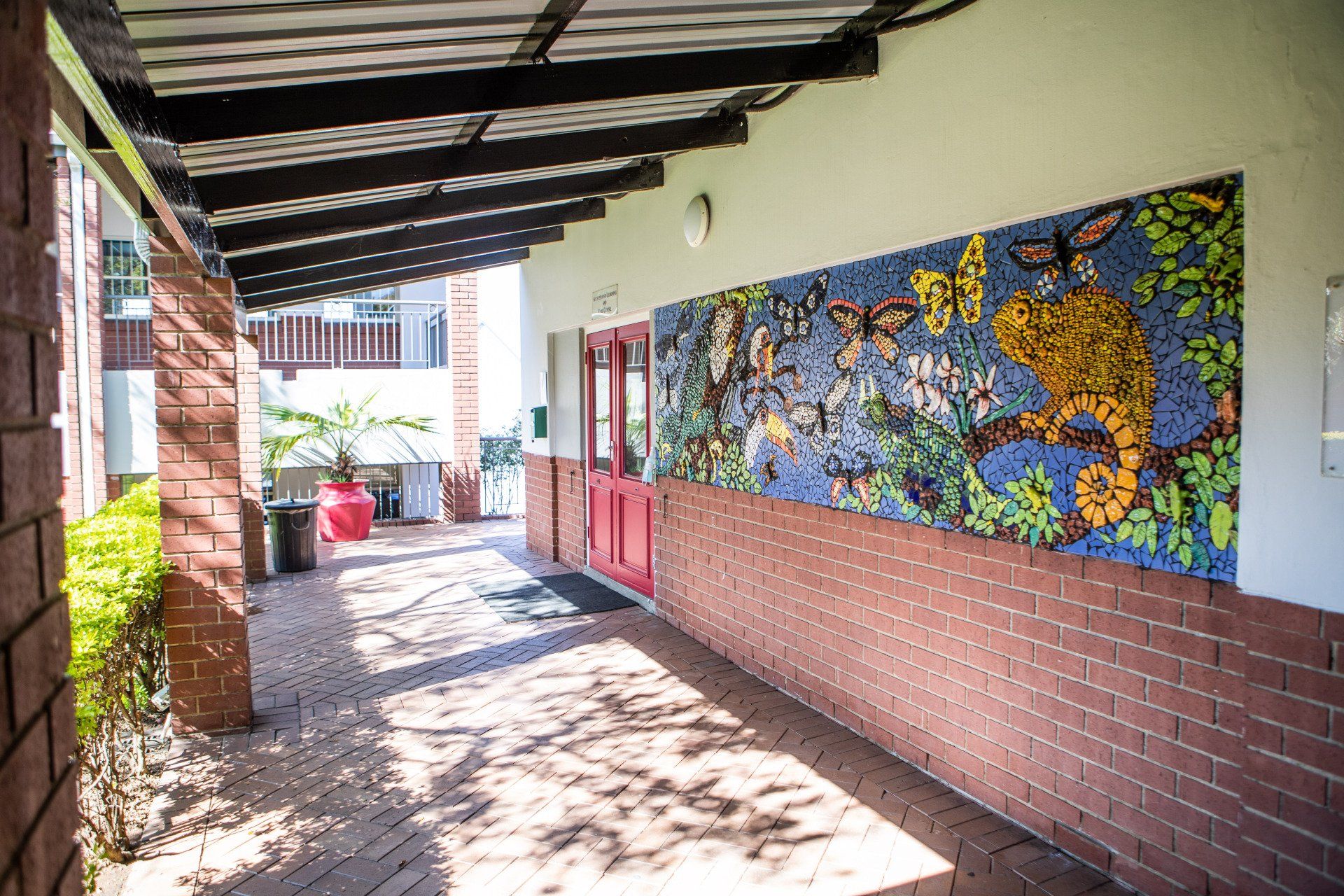 a hallway with a mosaic on the wall