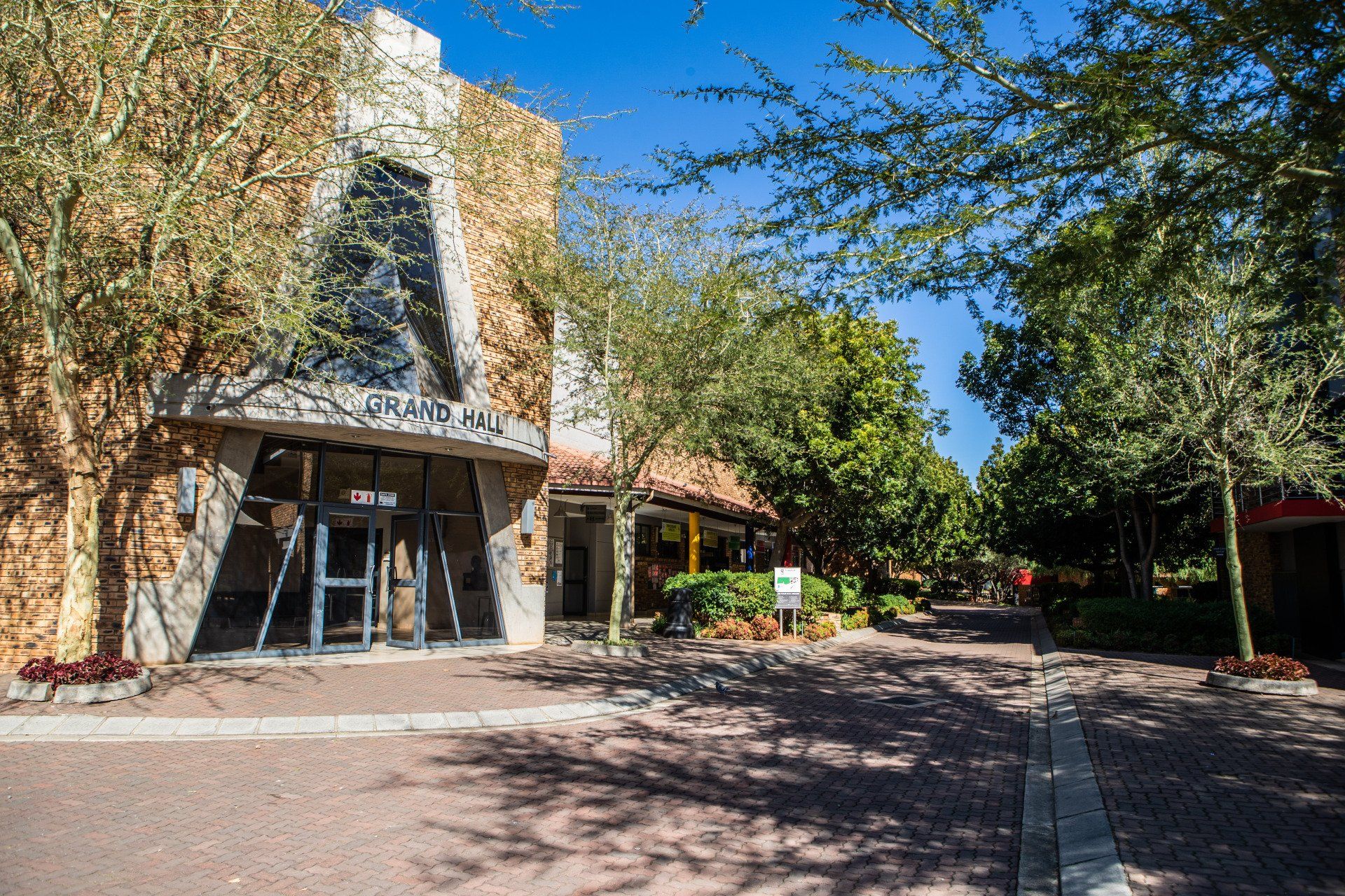 a large building with a lot of trees in front of it .