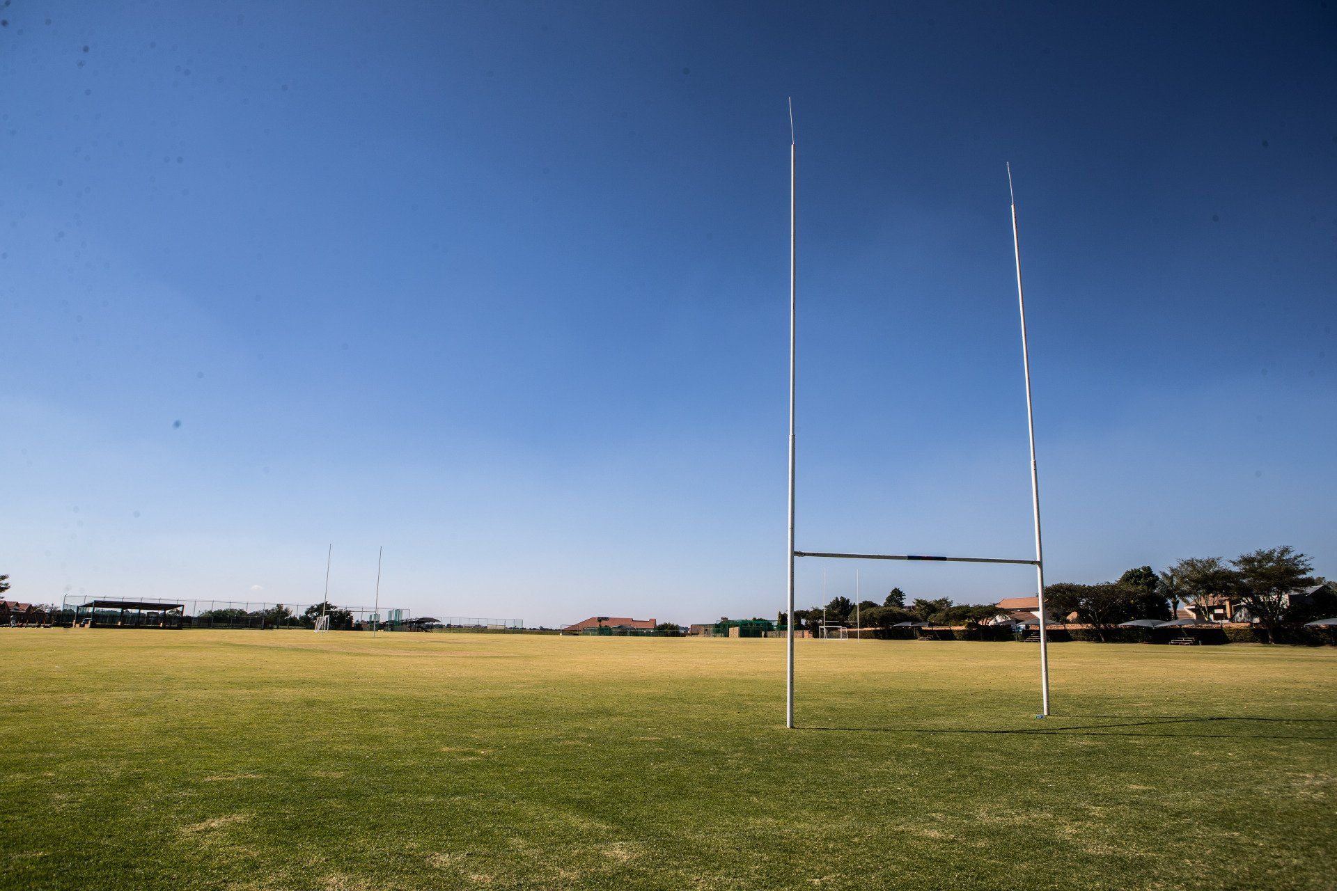 a rugby field with two goals in the middle of it