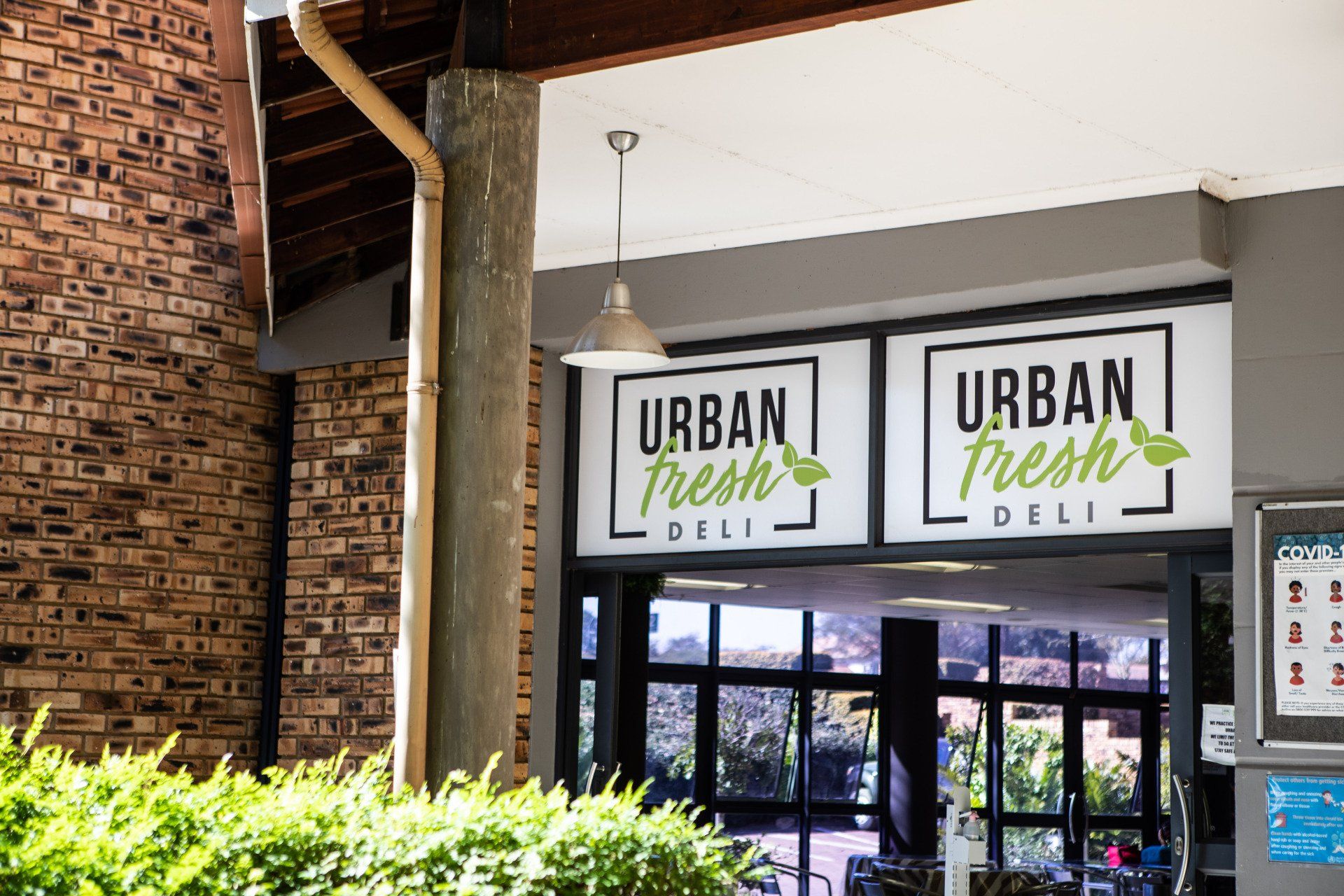 a restaurant called urban fresh deli is located in a brick building .