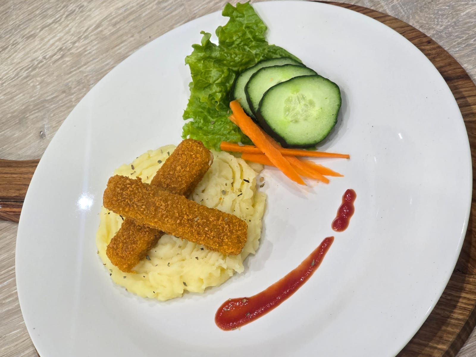 a bowl of spaghetti with meat and vegetables on a table .