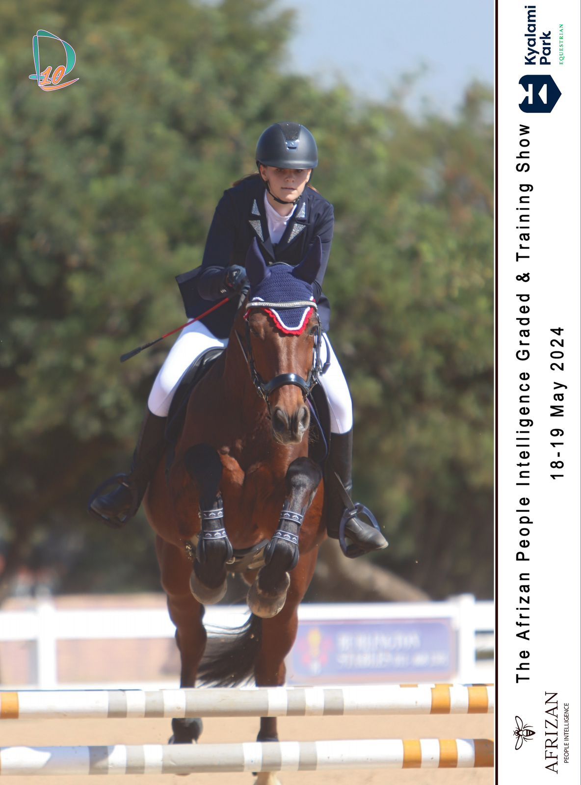 A person is riding a horse over a jump.