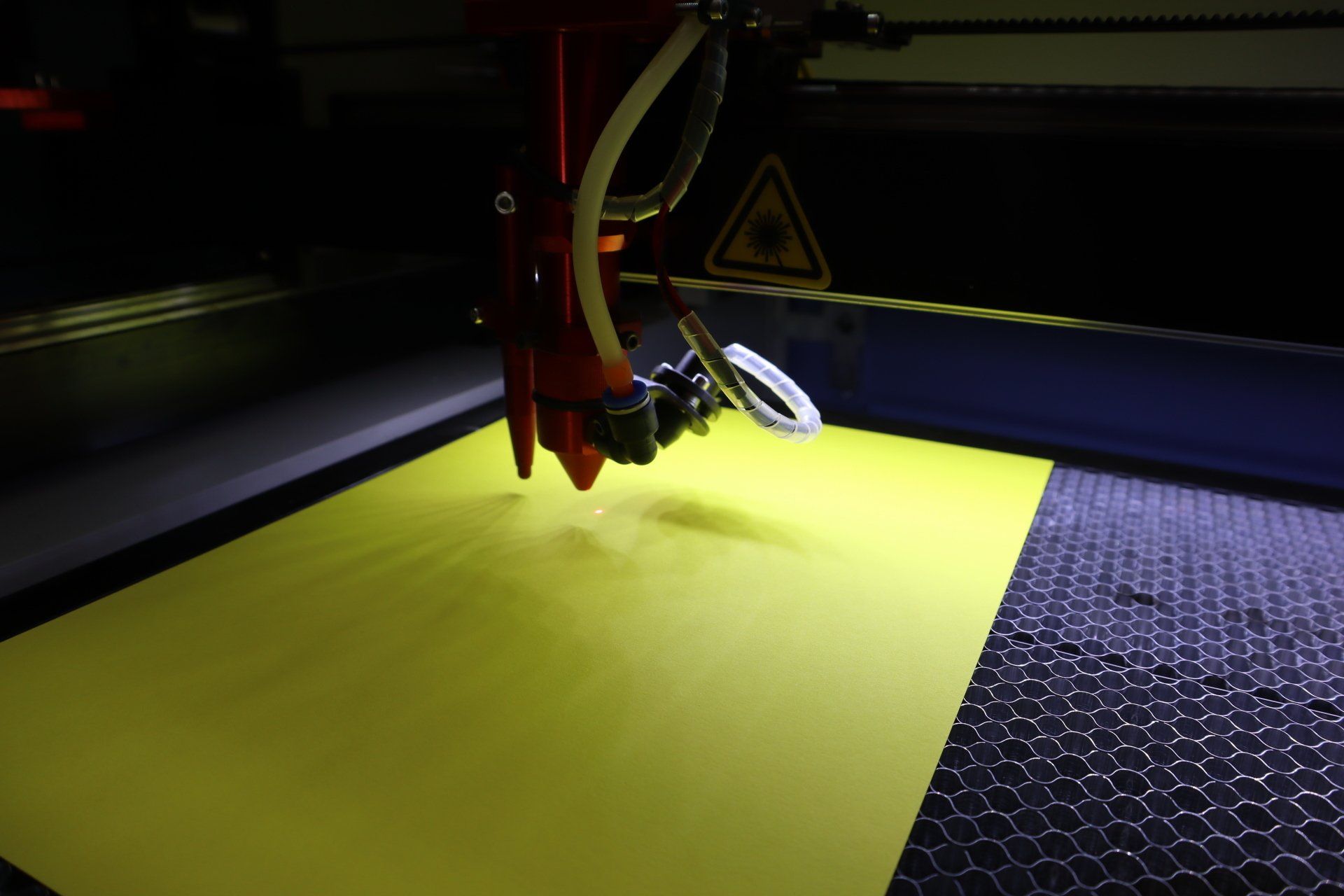 a machine is cutting a yellow object