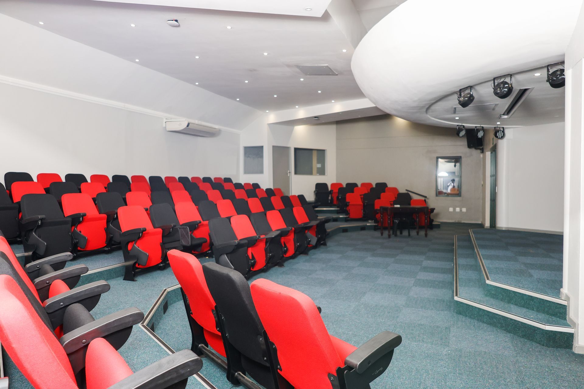 an aerial view of a swimming pool in the school
