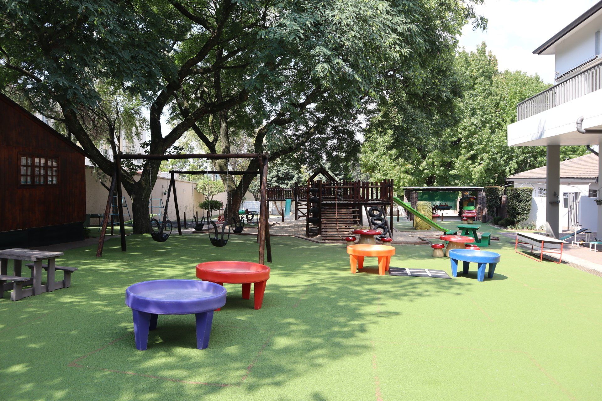 a playground with tables and benches