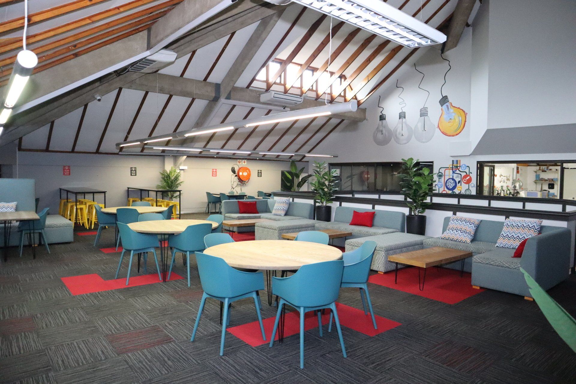 a large room with tables and chairs in it