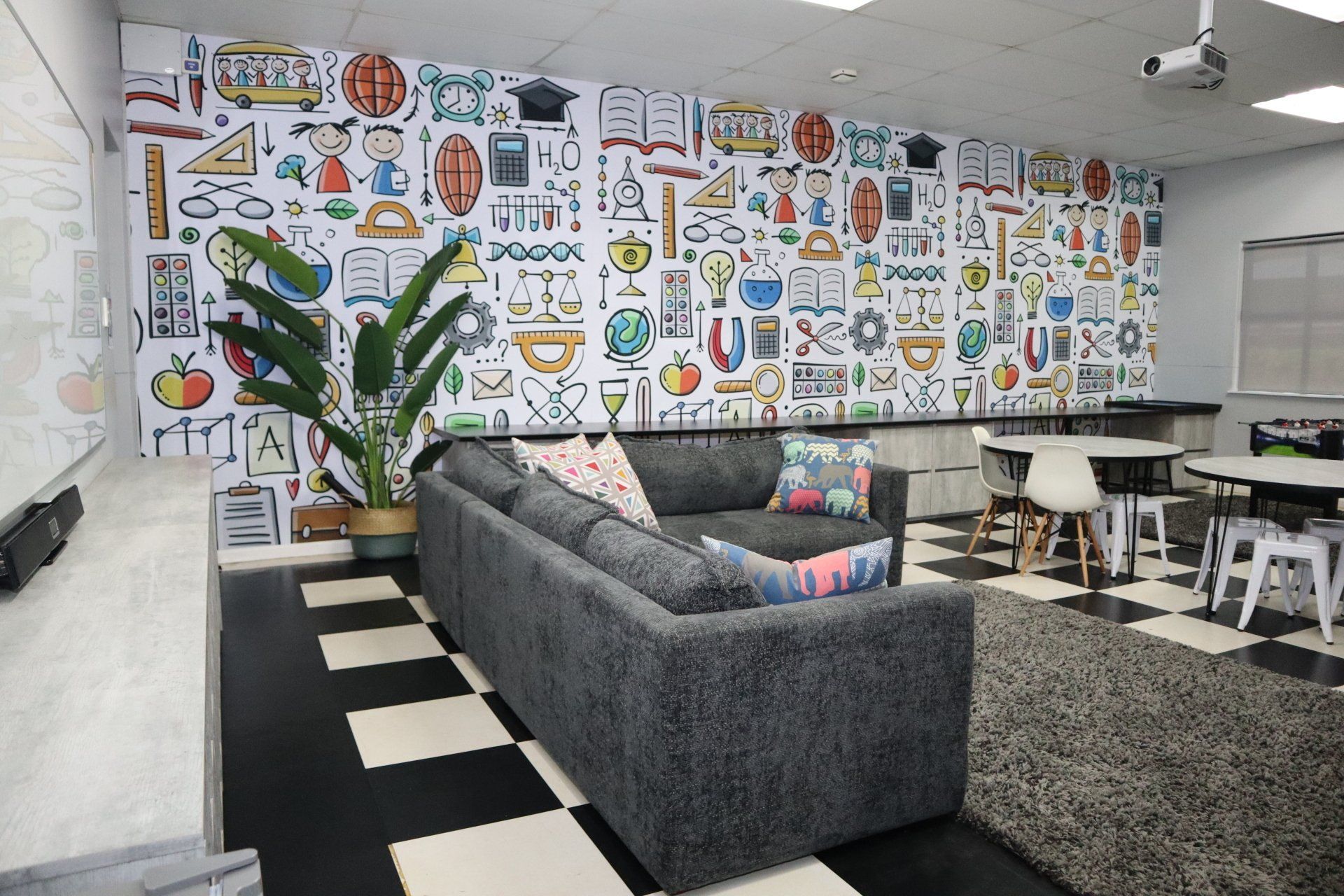 a club room with a couch and a checkered floor .