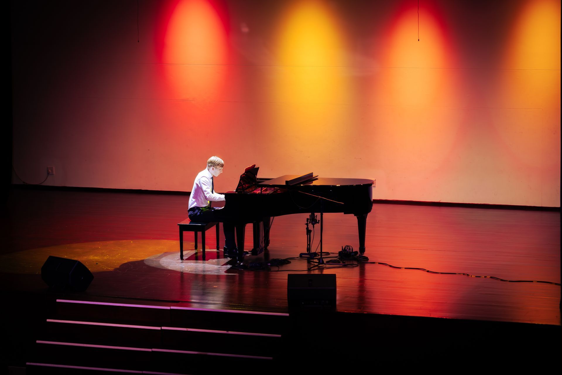 a pearl drum set in a room with a window
