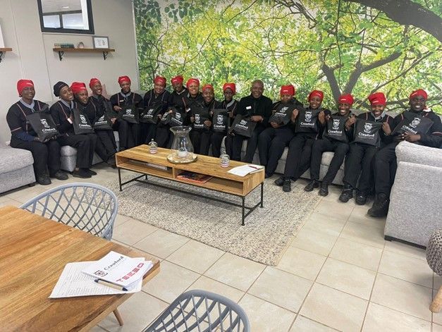 A group of people are sitting in a living room.