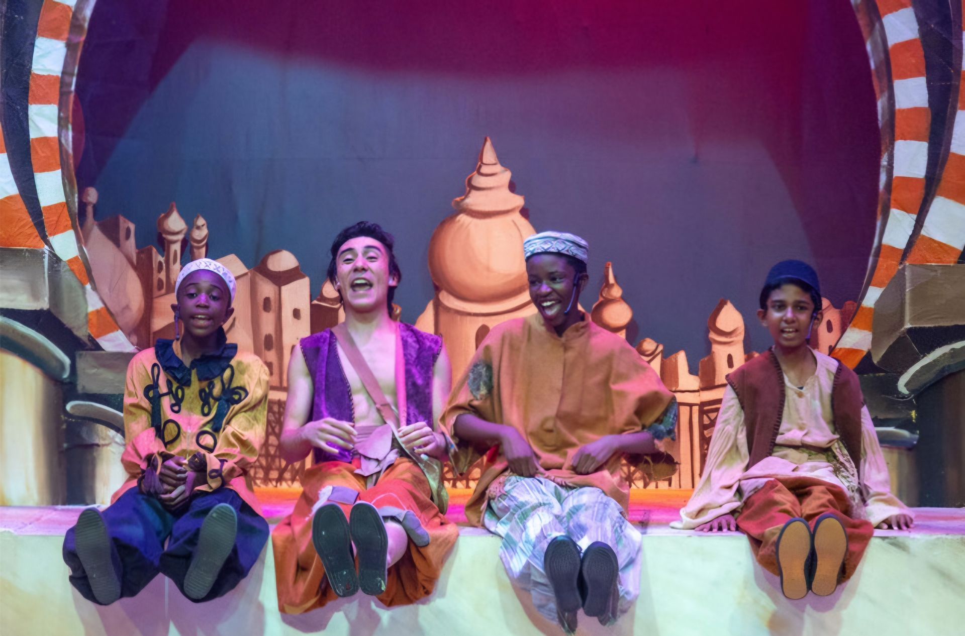 A group of people are sitting next to each other on a stage.