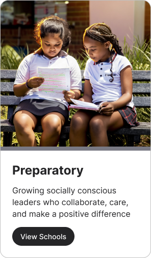 Two schoolgirls reading on a bench; text promoting preparatory education.