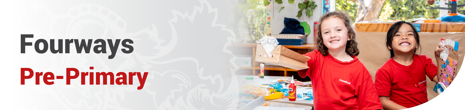 A young boy wearing glasses is looking at a computer screen.