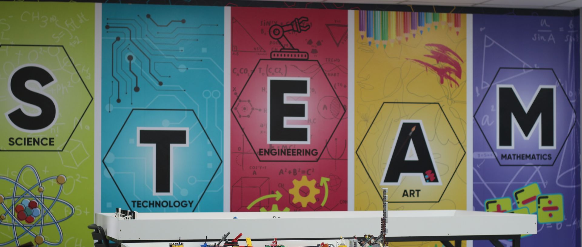 a tablet with a keyboard attached to it is sitting on a wooden table .