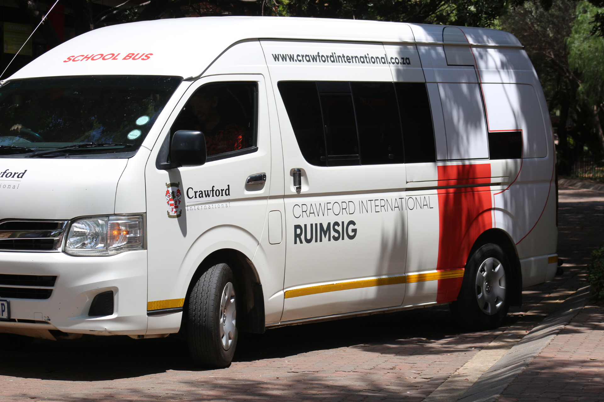 a bus is parked on the side of the road .