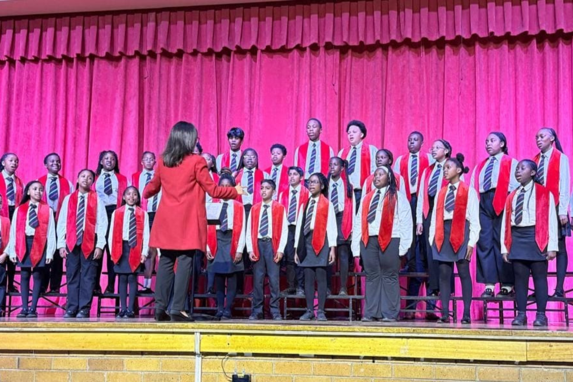a group of children are playing xylophones in a classroom .