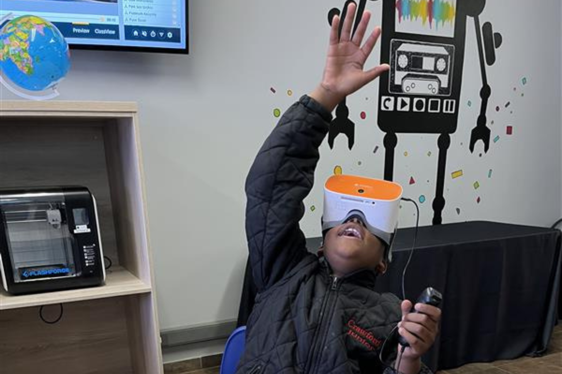 a woman is wearing a virtual reality headset and holding a remote control .