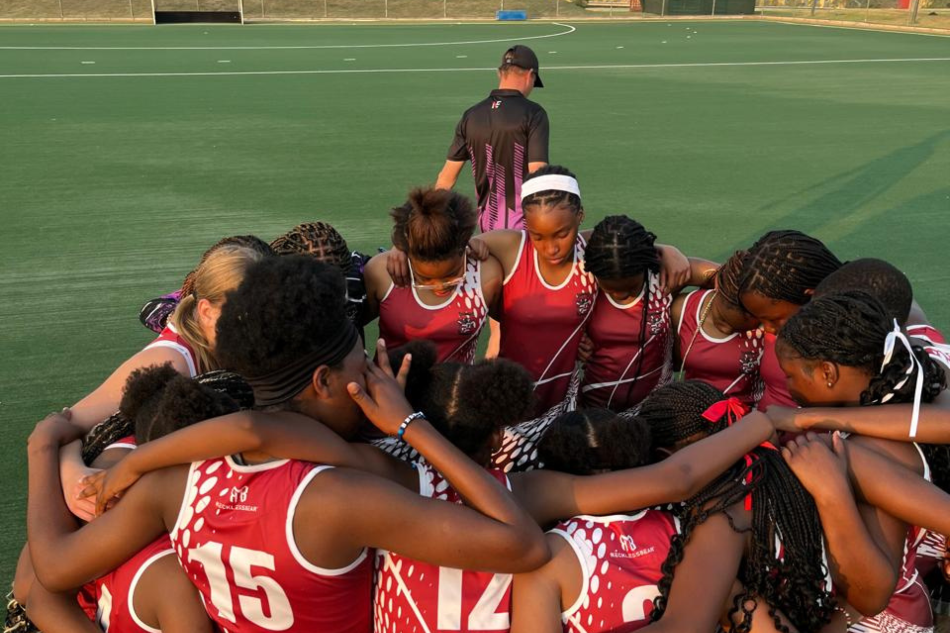 a rugby field with two goals in the middle of it