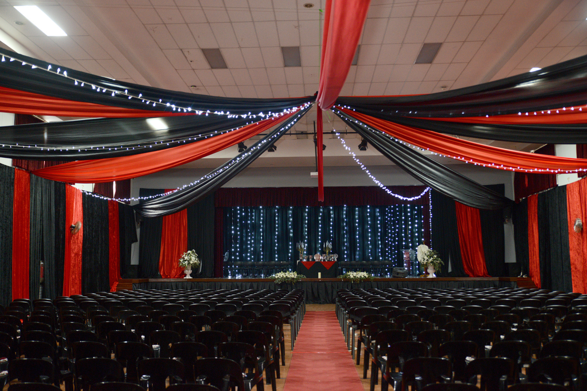 an aerial view of the campus with a soccer field in front of it .