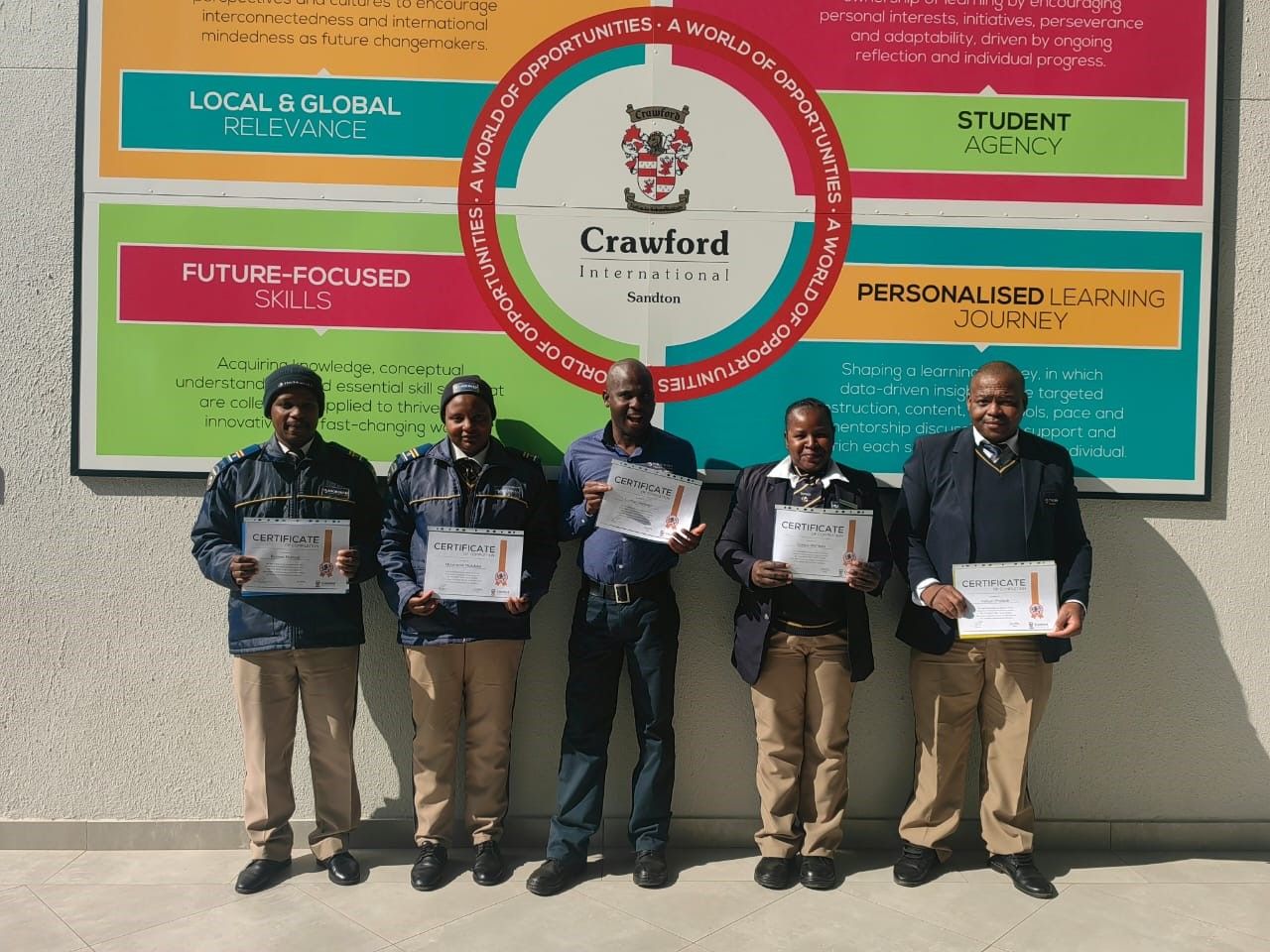 A group of people standing in front of a sign that says crufford