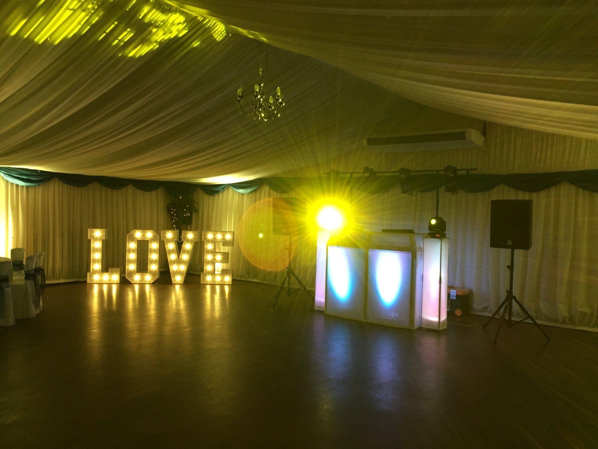 Wedding reception dance floor with lit 