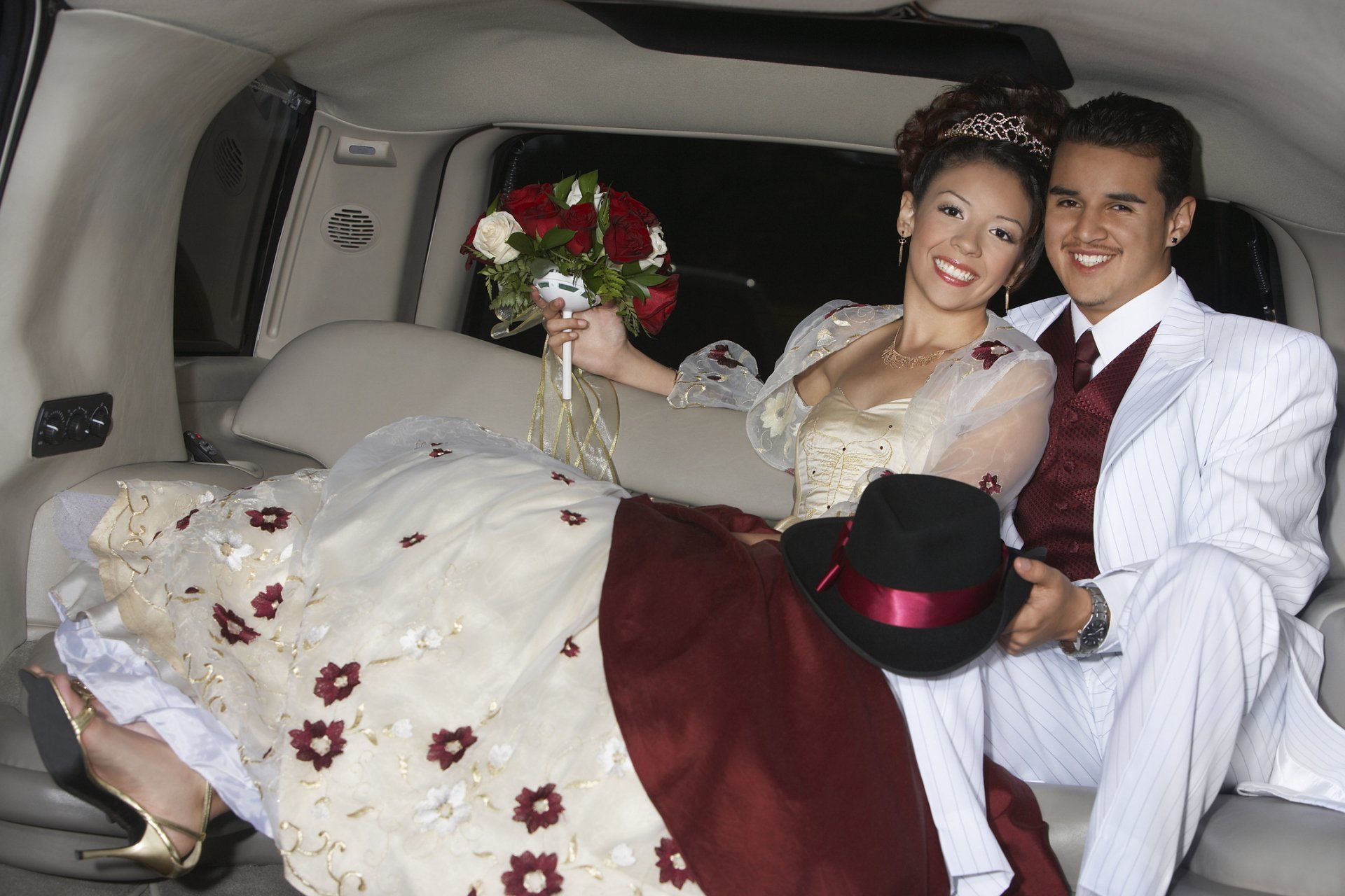 Girl and boy (13-15) in limousine at Quinceanera
