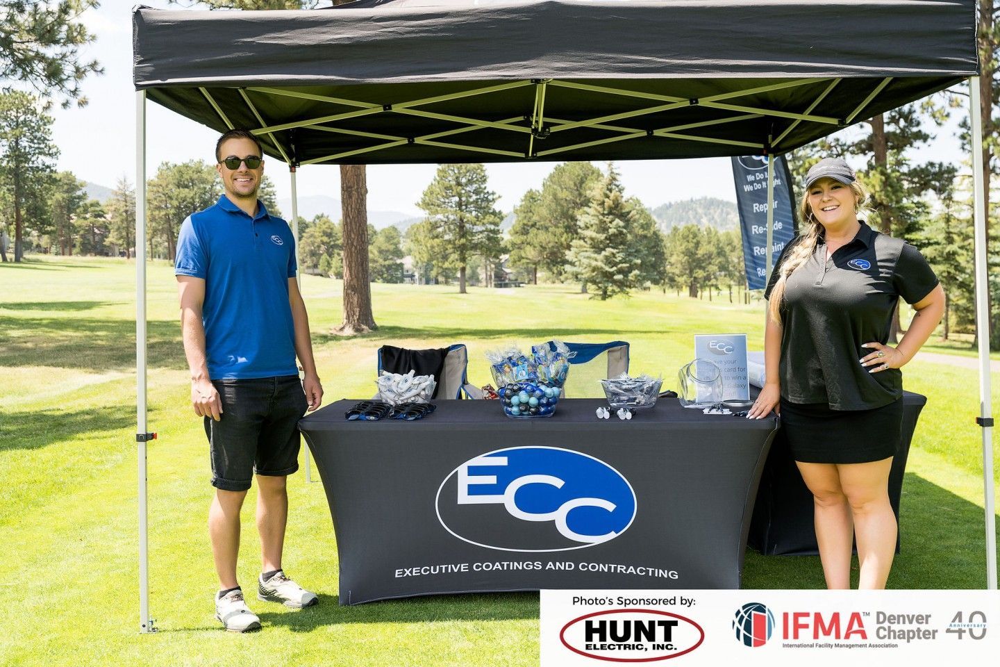 Two people at an event booth with 