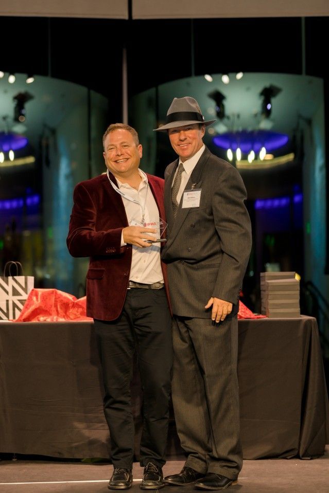 Two men stand together