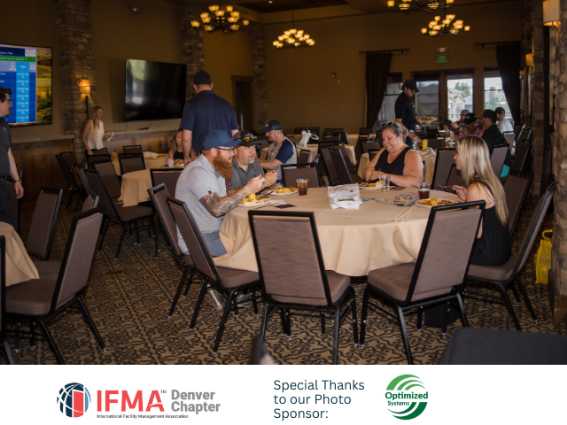 People at round tables in a restaurant, eating and talking. Event sponsored by IFMA Denver Chapter.