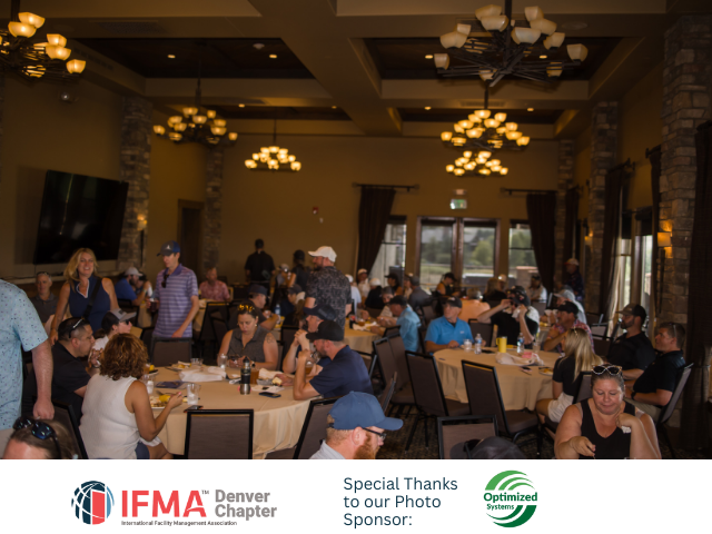 People at tables in a brightly lit banquet hall. IFMA event with sponsor logos visible.