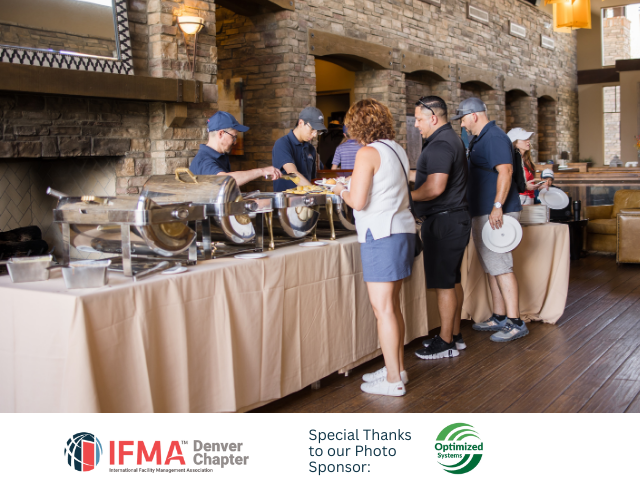 People at a buffet, serving food. A brick wall and fireplace are in the background. IFMA Denver Chapter logo visible.