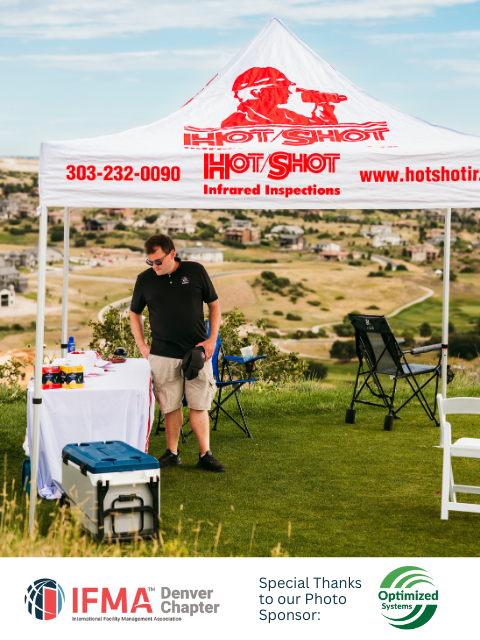 Man stands at a white tent,