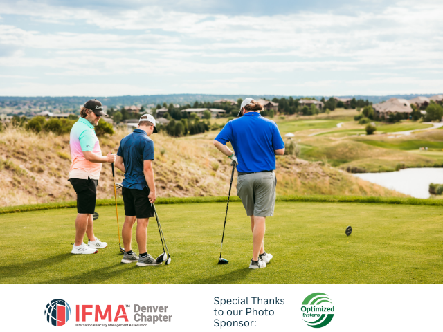Three golfers on a green, preparing to tee off on a sunny day.