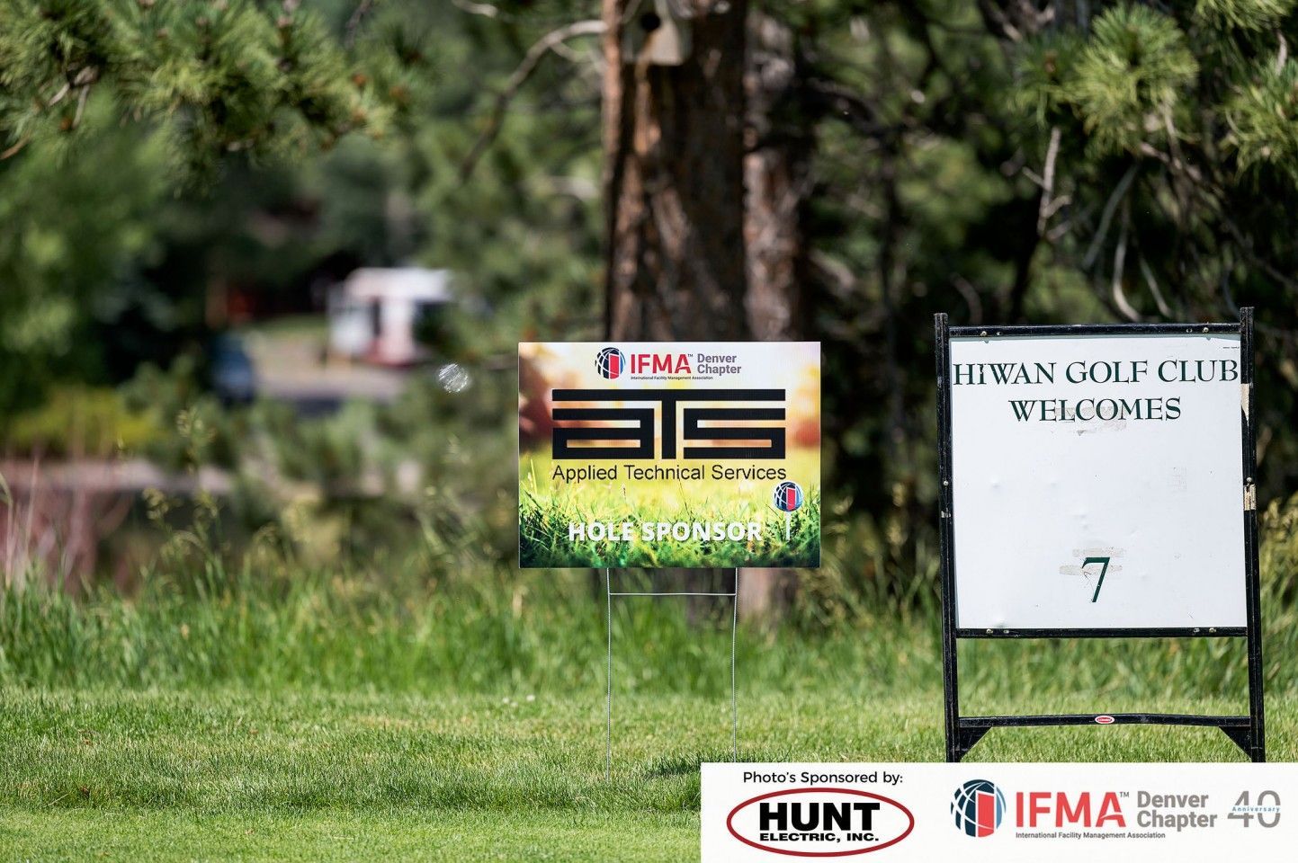 Golf course sign, hole 7, sponsored by IFMA, with a sign for 