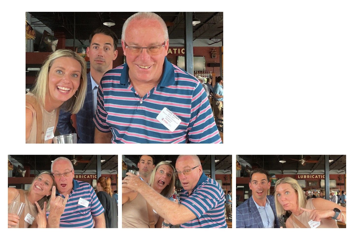 People taking pictures at a gathering, one man wearing a blue-striped shirt smiles.