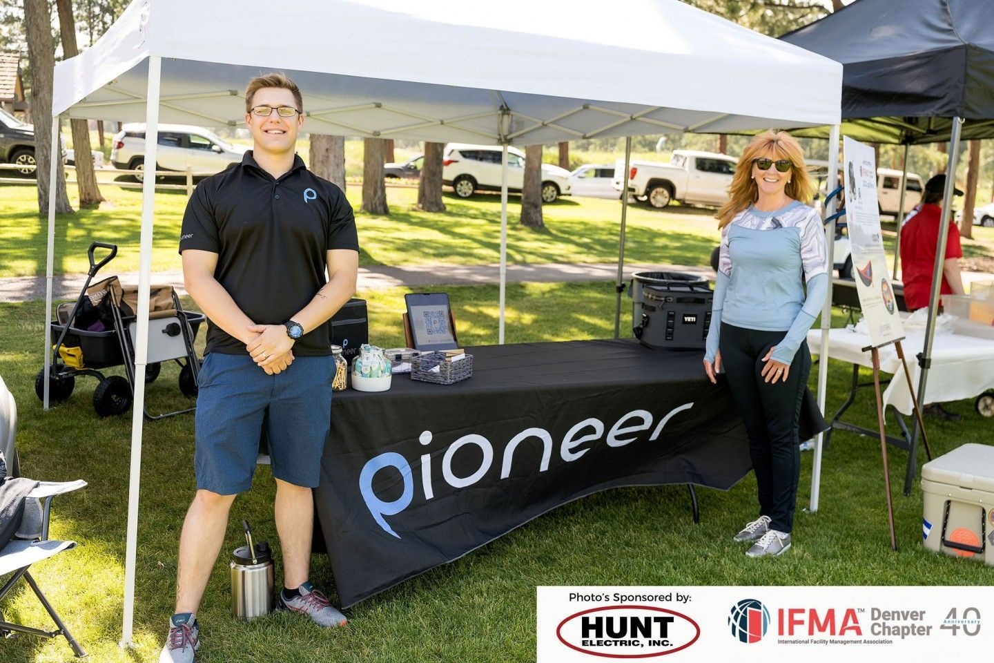 Two people stand at a 