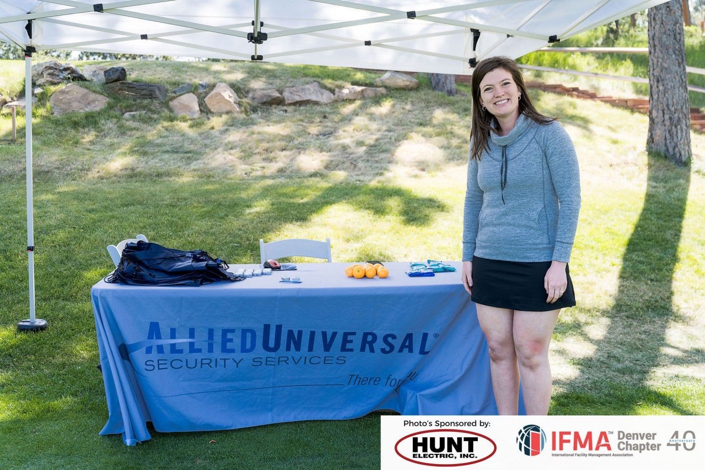 Woman stands near a table with an 