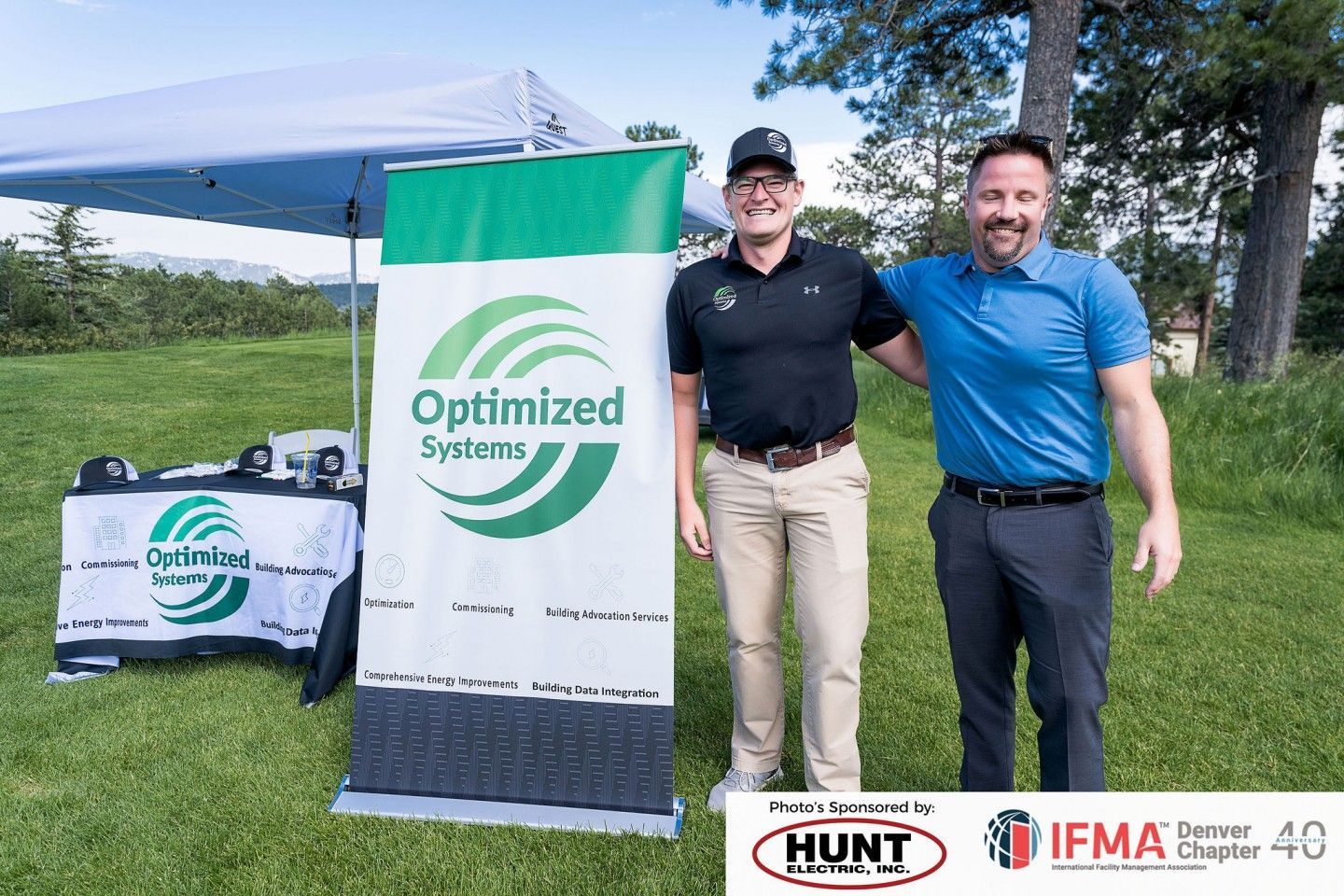 Two men stand beside an 