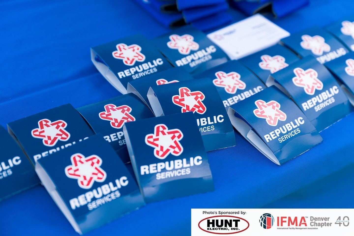 Close-up of Republic Services promotional items on a blue surface.