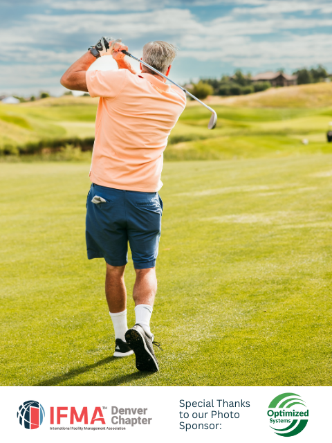 Golfer in peach shirt and blue shorts swings a golf club on a green course under a sunny sky.