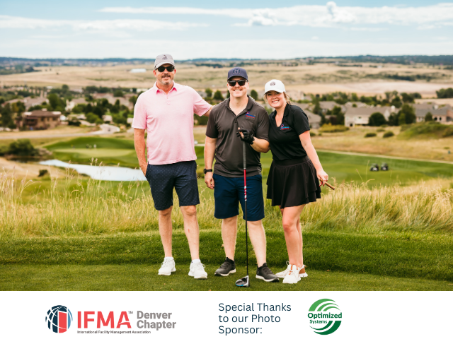 Three people on a golf course posing. Man in pink shirt, man in black shirt with golf club, woman in black skirt.