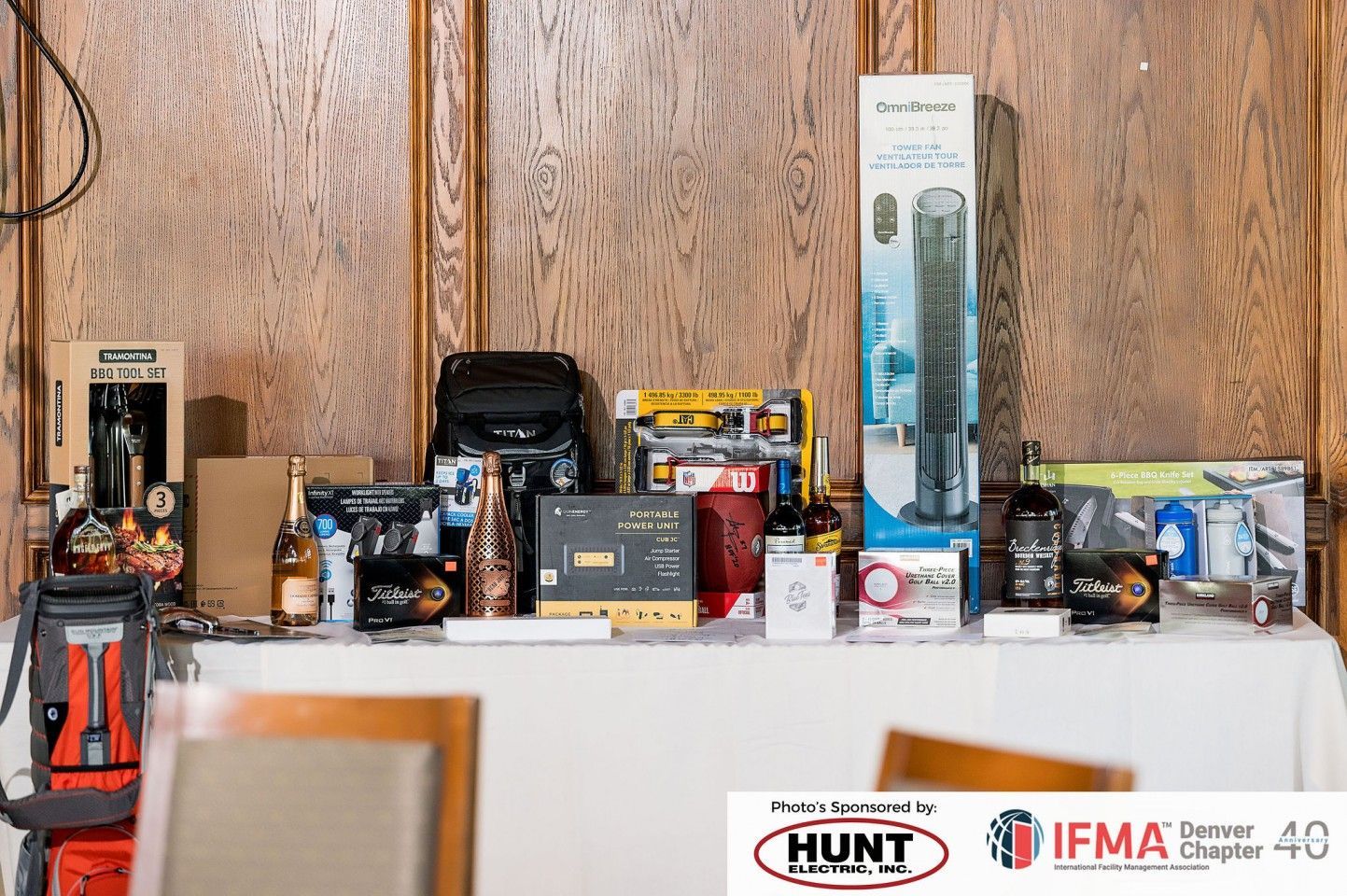 Table with various items, including boxes, bottles, tools, and a humidifier, on display.