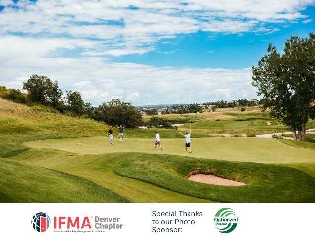 Golfers celebrating on a green golf course under a blue sky.