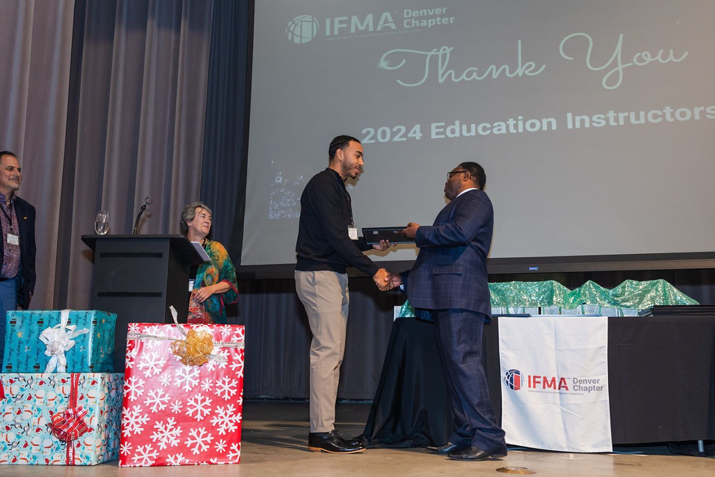 Man receives an award onstage.