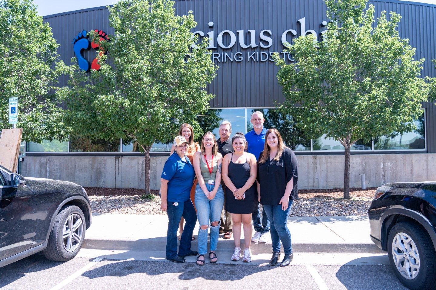 Group of people standing in front of a building with